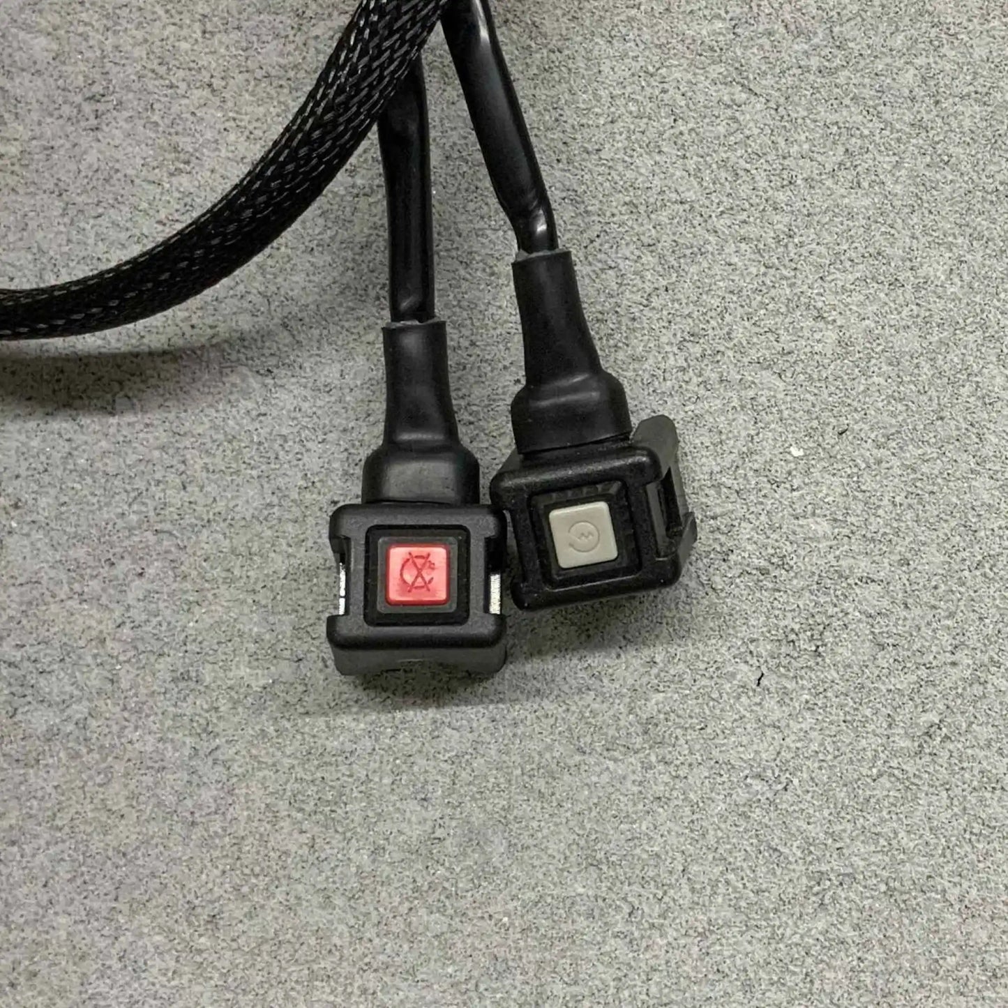 Front two black connectors with switches on a gray surface