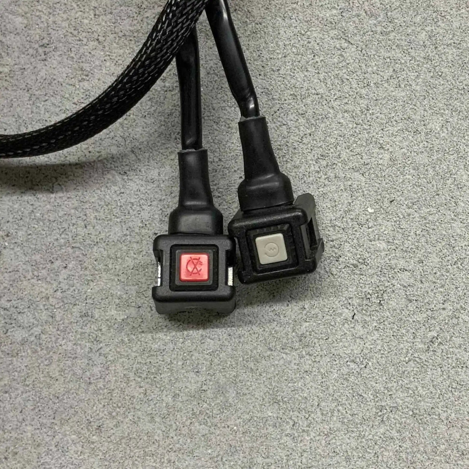 Front two black connectors with switches on a gray surface