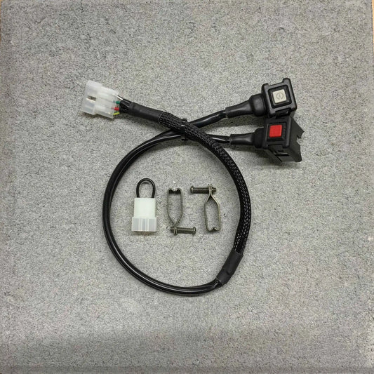 Wiring harness with connectors and switches on a gray surface